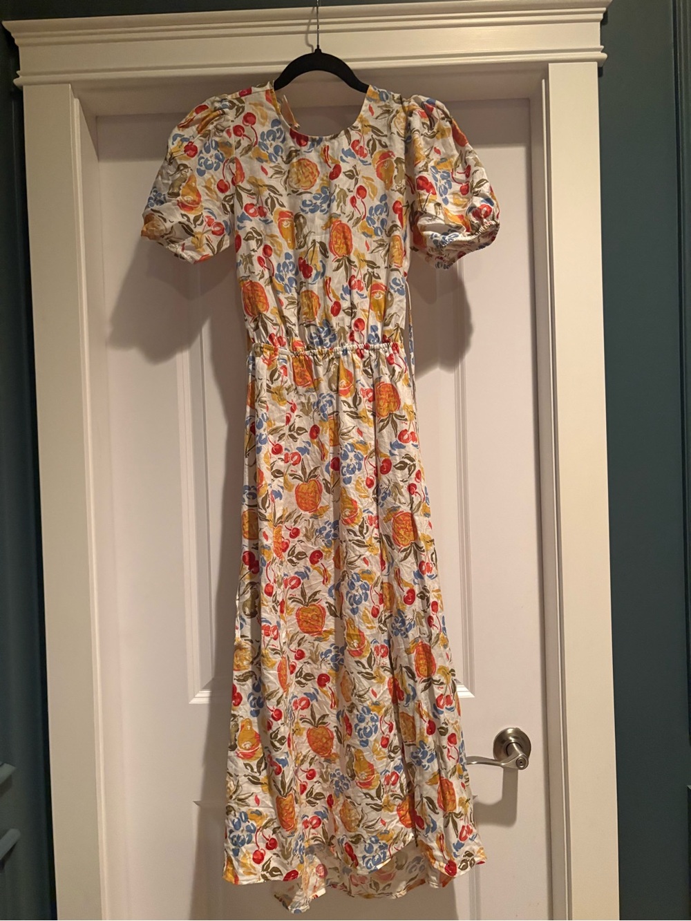Reformation 100% linen cream fruit print with side slit.